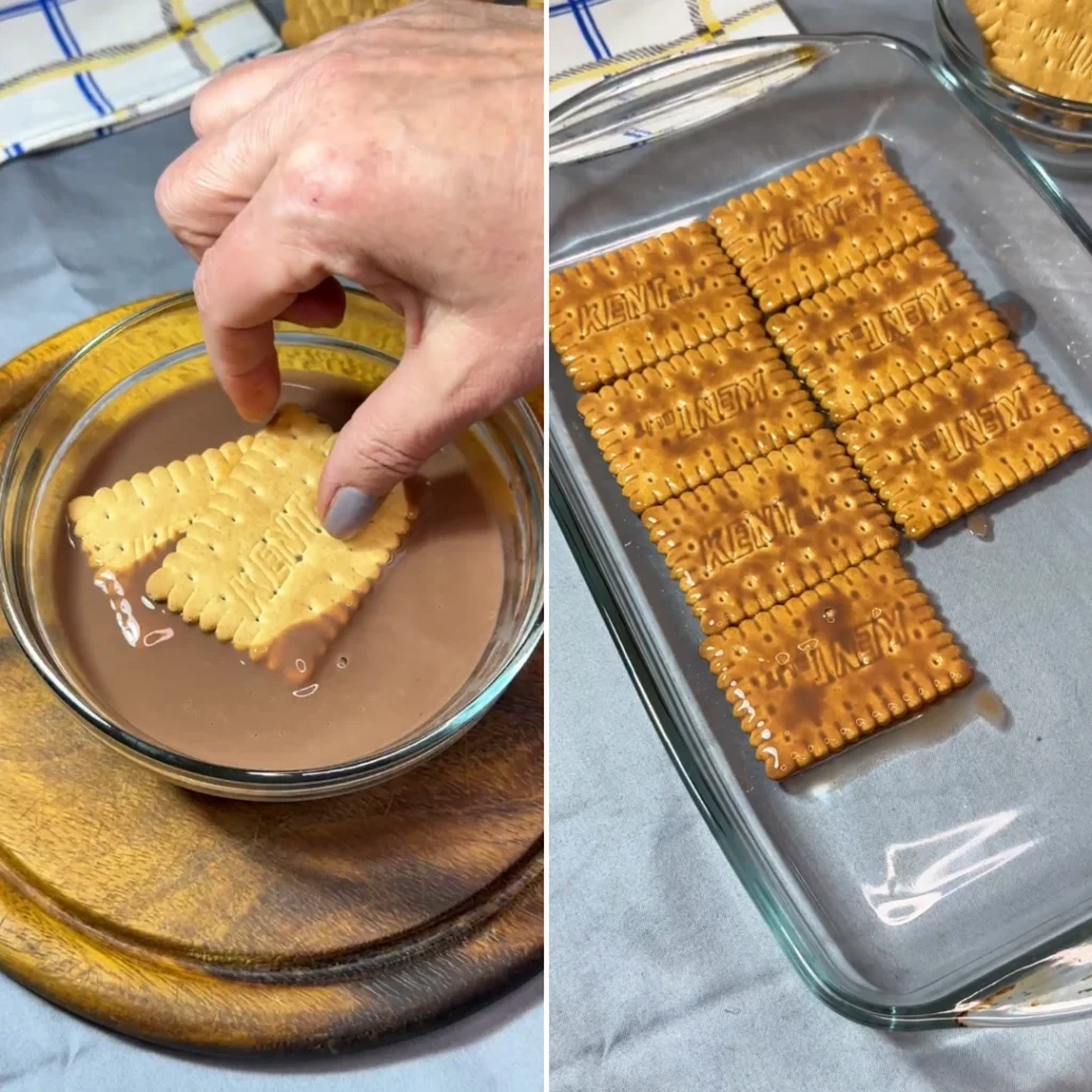 Umakanje petit keksa u zdjelicu s toplim čokoladnim mlijekom prije slaganja u pleh
